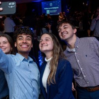 Group of 4 students take a selfie together